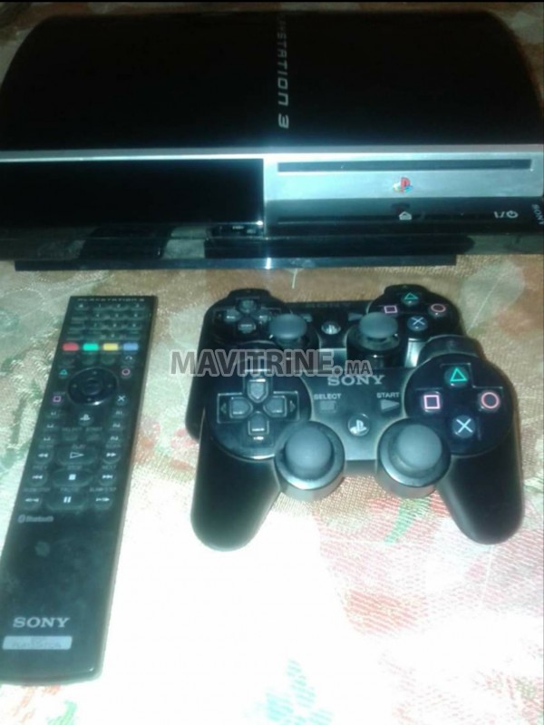 PS3 avec deux Manette Dual Shock 3 et 13 jeux