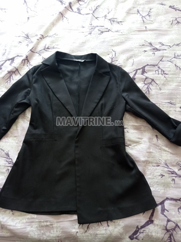 Blazer noir très bonne qualité demi manches