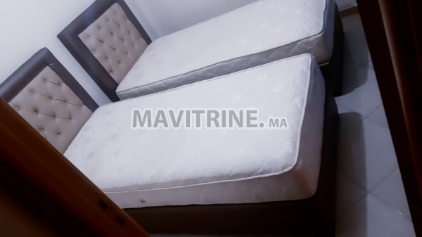 Deux lits rabattables + matelas ressort